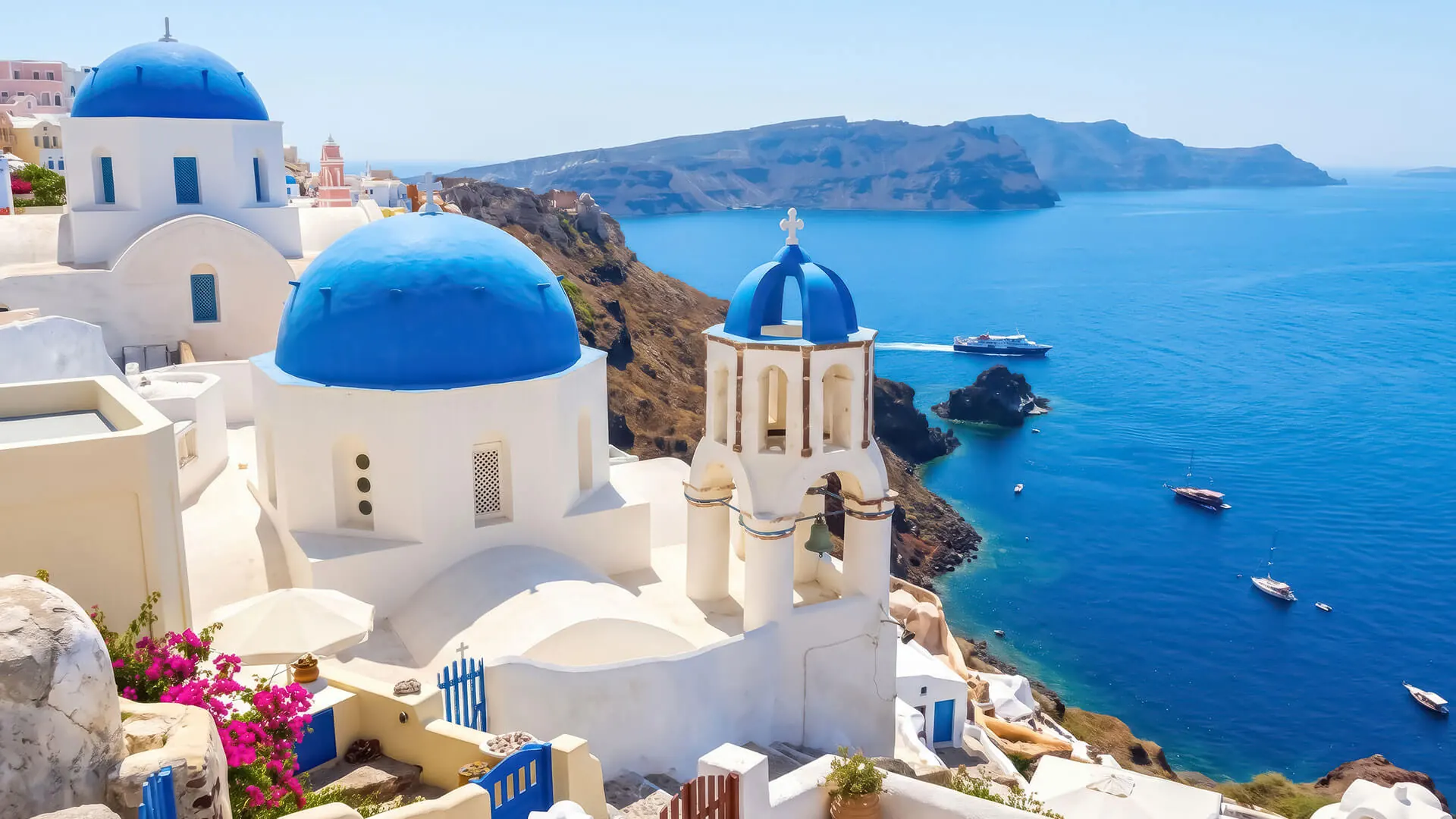 Blue-domed churches above the caldera in Oia, Santorini, Greece